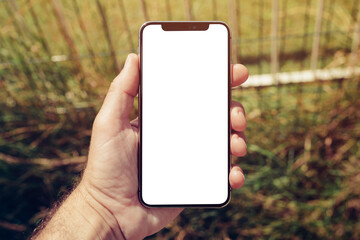 Mockup of smartphone screen on the street in urban surrounding