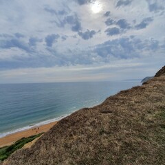 view over a mountain onto the sea