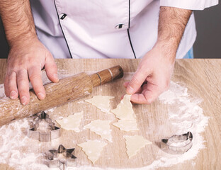 male cook preparing Christmas cookies