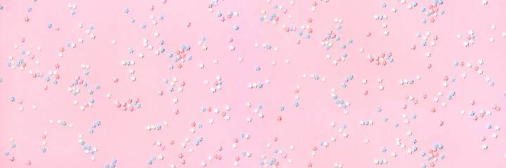 Pink banner with blue, white and pink stars. Holiday concept.