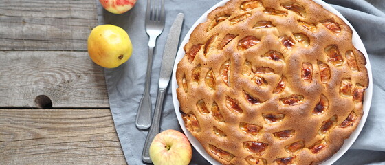 Summer round apple pie or muffin on an ancient ancient table.Homemade baking.