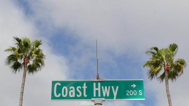 Pacific Coast Highway, historic route 101 road sign, tourist destination in California USA. Lettering on intersection signpost. Symbol of summertime travel along the ocean. All-American scenic hwy.