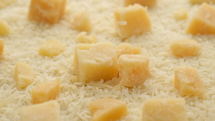 hard cheese parmesan grated and pieces close up