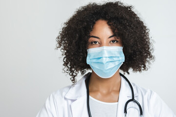 portrait of an afro female doctor with a surgical mask