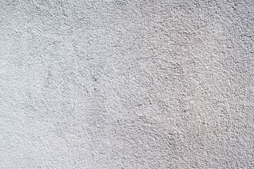 Beschaffenheit einer weißen Rauputzmauer als abstrakter Hintergrund