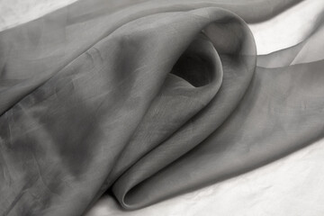 Twisted twirl of organza fabric gray texture