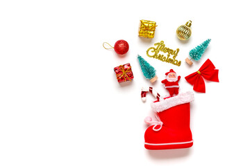 set of christmas decorations - santa claus, tree, boxes, bauble, bow, lollipop scattered from red boot isolated on white background Top view Flat lay Happy new year creative concept Holiday card