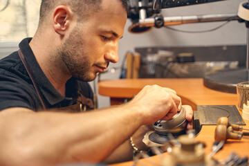 Focused young man working in a studio