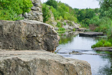 Fototapeta na wymiar a beautiful mountain stream flows among stones and rocks