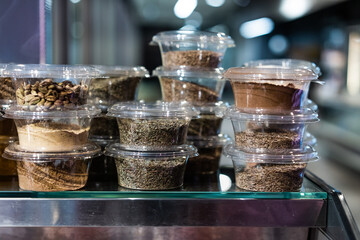 various spices and herbs packed in small transparent plastic boxes