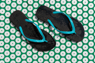 Massage mat for acupuncture and swimming pool flip- flops.