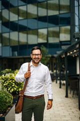 Portrait of a happy businessman, downtown.