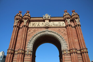 Fototapeta premium The triumphal Arch of Barcelona on the background of bright blue sky in Barcelona. Catalonia, Spain.