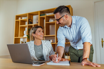 Working at their home office.