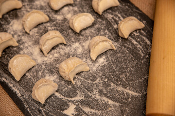 hand-made dumplings on a black background
