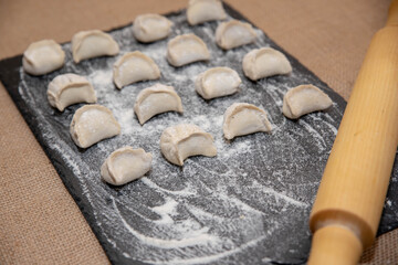 hand-made dumplings on a black background
