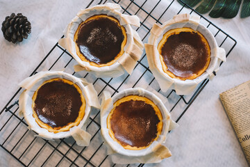 Basque burnt cheesecake homemade on white cheesecloth background