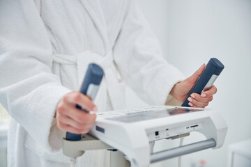 Woman is monitoring her individual progress after physical exercise