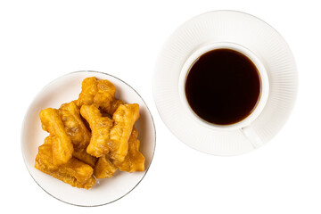 Top view of deep-fried dough stick in a whte plate and black coffee in white ceramic cup on white background with clipping path.
