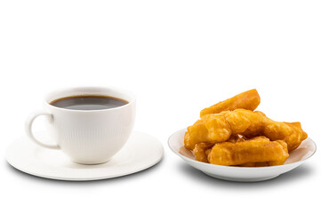 Breakfast with hot black coffee in white ceramic cup and a pile of deep-fried dough stick in white ceramic plate on white background with clipping path