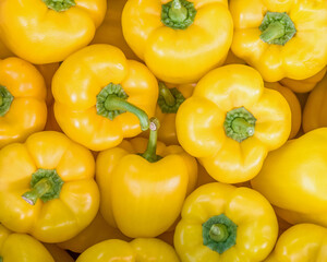colorful yellow peppers top view closeup, natural background