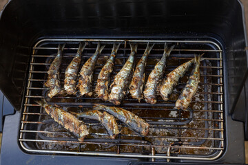 grilled sardines, fish on the electric grill, top view