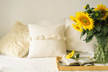 Still life in home interior of living room. Sunflowers, Coffee and open book. Read, Rest. Cozy Home
