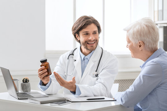 Young professional doctor prescripting new pills to senior woman