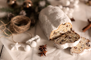 Fototapeta na wymiar Christmas stollen on wooden background. Traditional Christmas festive pastry dessert. Stollen for Christmas.