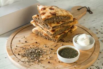 Stuffed qeema minced meat naan with herbs and spices and white butter