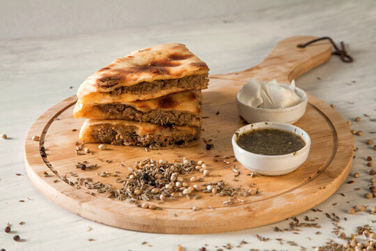 Stuffed qeema minced meat naan with herbs and spices and white butter