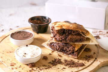 Hot brownie filled in naan bread sandwich perfect fusion dessert food with dips