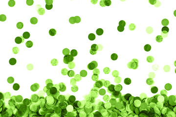 Festive green confetti background. Flat lay style.