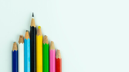 Colourful pencils are kept but only one pencil are clearly can be used to represent performance and leadership concept  