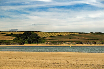Landscape showing farm fields near Rock beach, Cornwall on a sunny day
