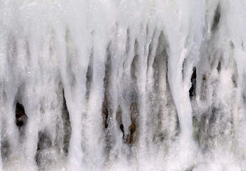 Background of bright transparent icicles in the sunlight.