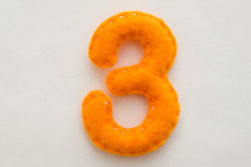 Handmade felt green number 3. Set of numbers from colorful felt isolated on white background