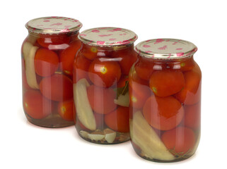 Canned and preserved tomatoes in glass jar isolated on white. Homemade pickled vegetables.