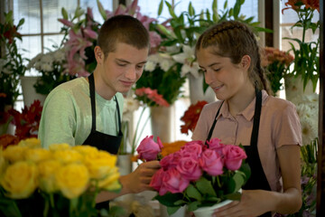 young people arrange flowers in the flower shop