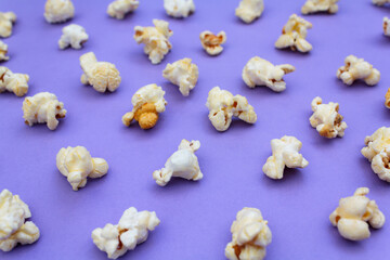 Popcorns on purple background