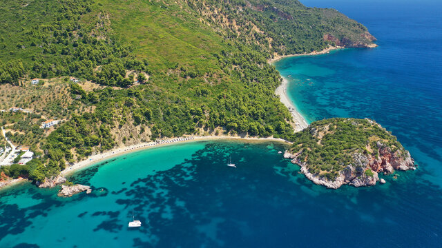 Aerial drone photo of beautiful turquoise sandy beaches of Stafilos and Velanio, Skopleos island, Sporades, Greece © aerial-drone