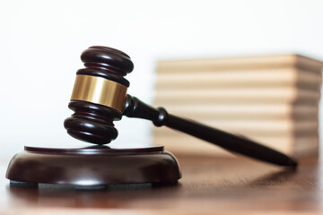 Judge's gavel with law books on the background