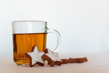 Tea and homemade cookies on white background