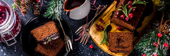 Chocolate Gingerbread Cake on festive background. Traditional Gingerbread cake with dark chocolate...
