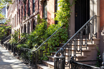 Historic brownstone buildings on a sunny summer day in the Gramercy Park neighborhood of New York City