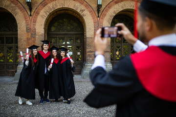 Group of students taking a picture in their graduation at University