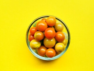 cup of tomato on a yellow background