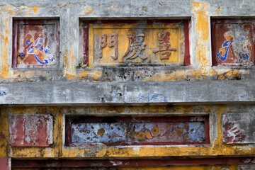 Hue, ancient capital of Vietnam. Wall decoration with inlay and paint