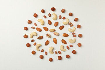 Different tasty nuts on white background. Vitamin food