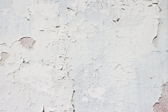 Grunge Style Urban Weathered Shabby White Peeled Painted Concrete Surface Of The Wall With Holes, Dirty And Cracks Macro